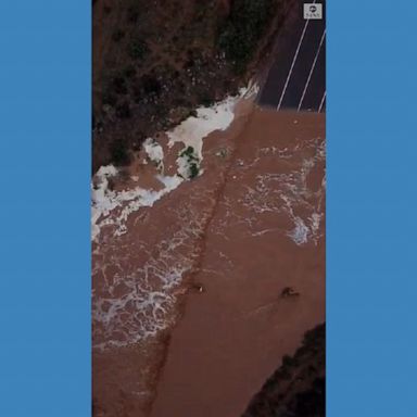 Water from a creek flooded a road in South Australia after heavy rainfall in the area.