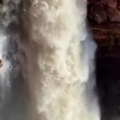 Water streamed down red sandstone as rain in Australia's Northern Territory revived some of the dry outback waterfalls in Watarrka National Park.