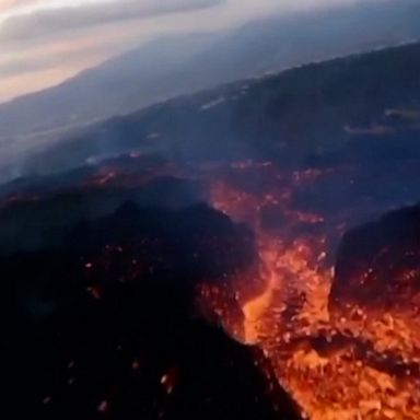 A drone sweeps over a sizzling lava stream from the Cumbre Vieja volcano as its activity shows no sign of stopping.