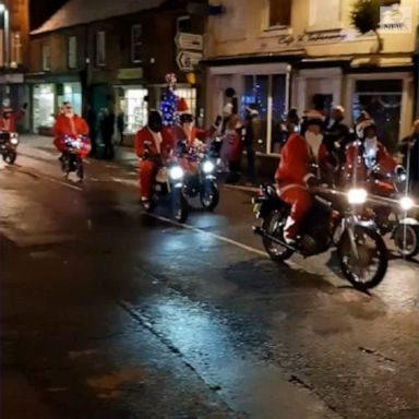 Santas in the U.K. skipped the sleigh and opted for scooters instead on their way to a Christmas lighting celebration.