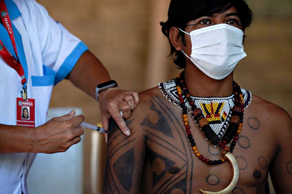 PHOTO: A Guarani indigenous man is inoculated with the Sinovac Biotech's CoronaVac COVID-19 vaccine at the Sao Mata Verde Bonita tribe camp, in Guarani indigenous land, in the city of Marica in Brazil, on Jan. 20, 2021.