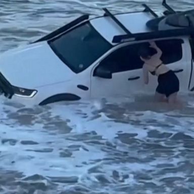 Strong waves triggered by a cyclone swept a man’s pickup truck into the waters off an Australian beach as locals embarked on a futile attempt to remove the vehicle.