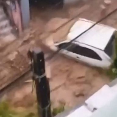 The video shows the moment extremely heavy rains set off a mudslide down a hill in the Brazilian city of Petropolis.