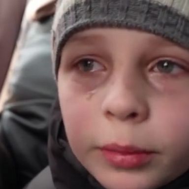 A heartbreaking moment as a young Ukrainian boy cries as he tells motorists who picked him up that he has left his father behind him in Kyiv.