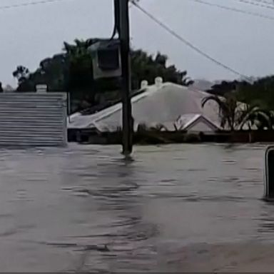 Whole towns are underwater after floodwaters swamped parts of Australia's east coast, forcing people to shelter on roofs and prompting around 1,000 rescues.