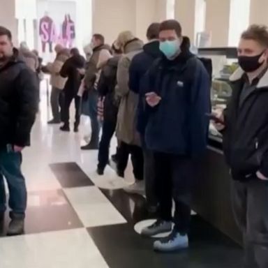 Long lines are developing at ATMs in Moscow, as international sanctions over the invasion of Ukraine impact Russia's economy.