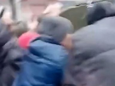 WATCH: Protesting civilians confront Russian military vehicles in Ukraine
