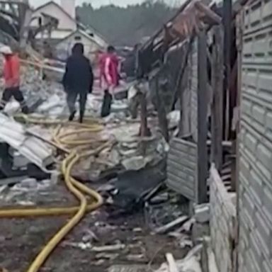 Four people were killed when homes in Zhytomyr were hit by a Russian cruise missile apparently aimed at a nearby air base, Ukrainian officials said.