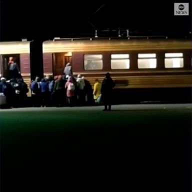 Video from Lubin, in the Poltava region of Ukraine, shows people arriving to the town in buses from the Sumy region and getting on trains to head farther west, part of a large-scale evacuation.