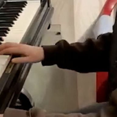 A girl played her family's piano in Kharkiv, Ukraine, as they prepared to evacuate their home amid Russian attacks.