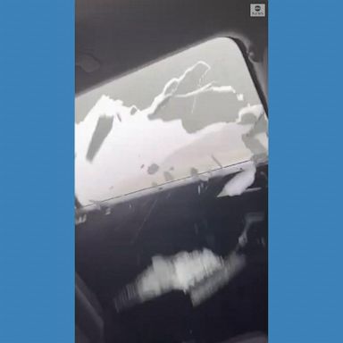 VIDEO: Friends huddle for safety as hail smashes car windows