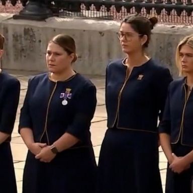 PHOTO: The staff of Buckingham Palace stood outside the gates, bidding farewell to the queen as the late monarch’s funeral procession streamed by.