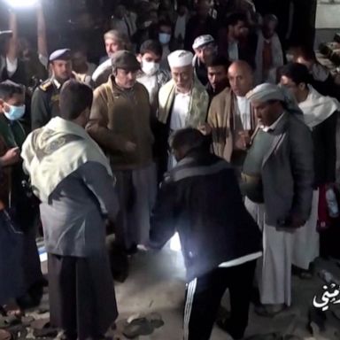 People were reportedly gathering in Yemen's capital, Sanaa, to receive handouts of the equivalent of $9 per person that were being distributed by merchants.