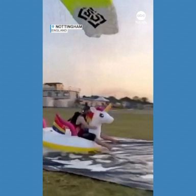 VIDEO: Skydiver lands on inflatable unicorn