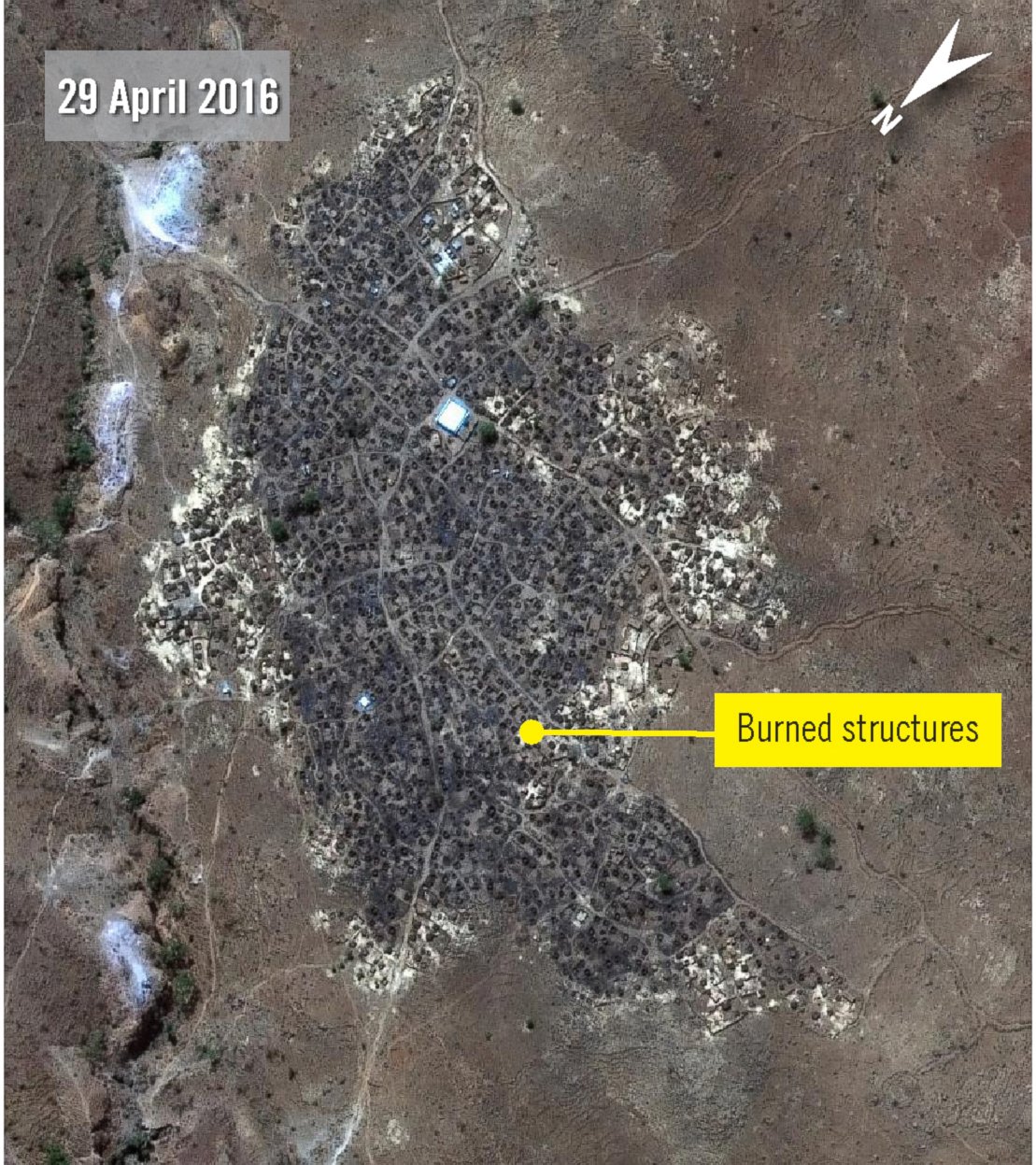 PHOTO: Karmal after attack - Imagery from 29 April 2016, shows Karmal village has been almost completely razed by fire. Only a few thatched roof tukuls, on the outer edges of the village, appear undamaged.