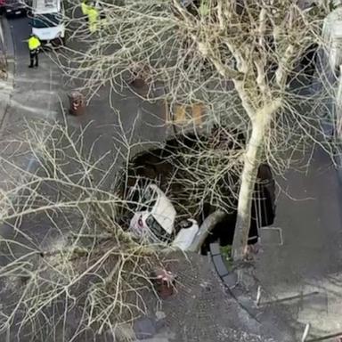 VIDEO: 2 cars swallowed by sinkhole