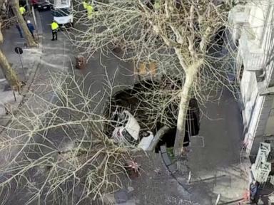 WATCH:  2 cars swallowed by sinkhole