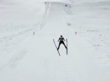 WATCH:  Olympic champion soars to new ski jump record