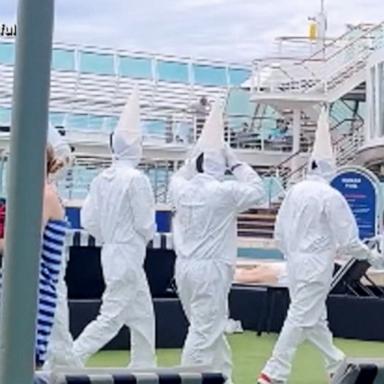 The cruise line later said the workers wearing the white hoods weren't aware of the resemblance and issued an apology. 