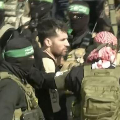 VIDEO: Special Report: Hamas escorts 3 hostages onto stage prior to release 