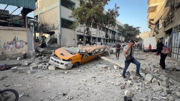 Palestinians flood aid distribution center as new aid operation starts in Gaza