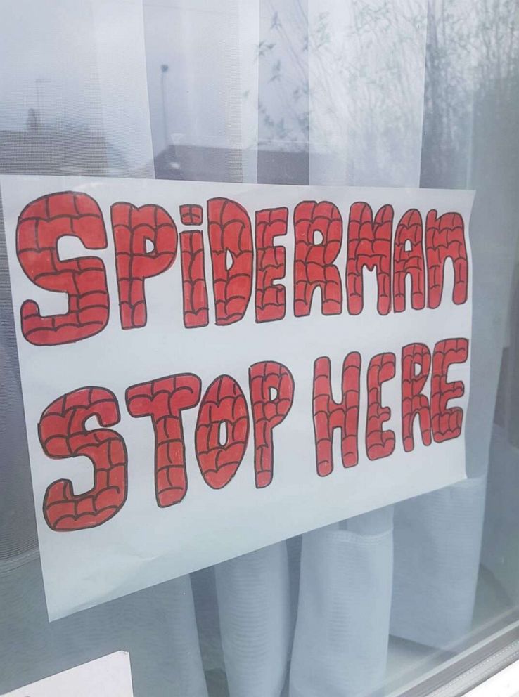 PHOTO: With the United Kingdom mired in the second week of an unprecedented lockdown over the COVID-19 outbreak, Andrew Baldock and Jason Baird in Stockport, England, had an idea to run around as Spider-Man to cheer up children stuck indoors. 