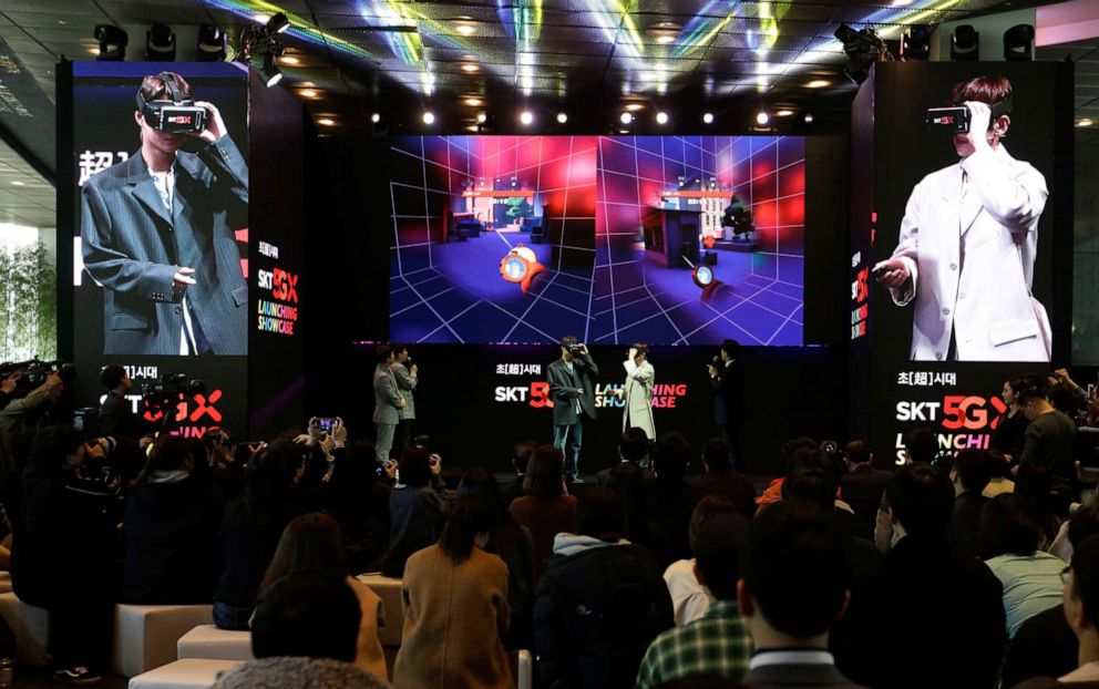 PHOTO: Participants wear VR devices for an audio-visual experience during a media showcase for 5G service of SK Telecom in Seoul, South Korea, April 3, 2019. 