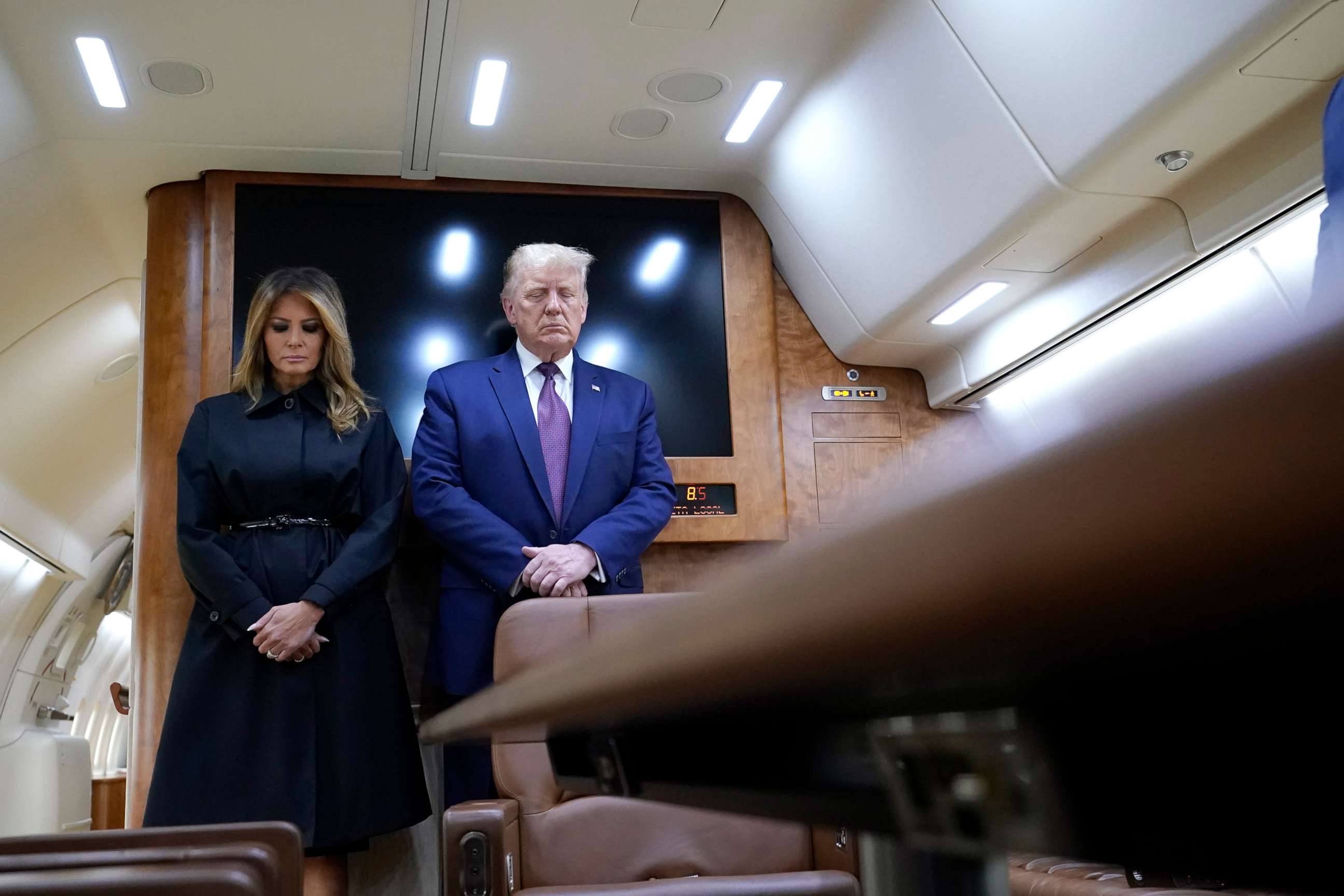 PHOTO: President Donald Trump and first lady Melania Trump pause for a moment of silence on Air Force One as he arrives at the airport in Johnstown, Pa., on his way to speak at the Flight 93 National Memorial, Sept. 11, 2020, in Shanksville, Pa.