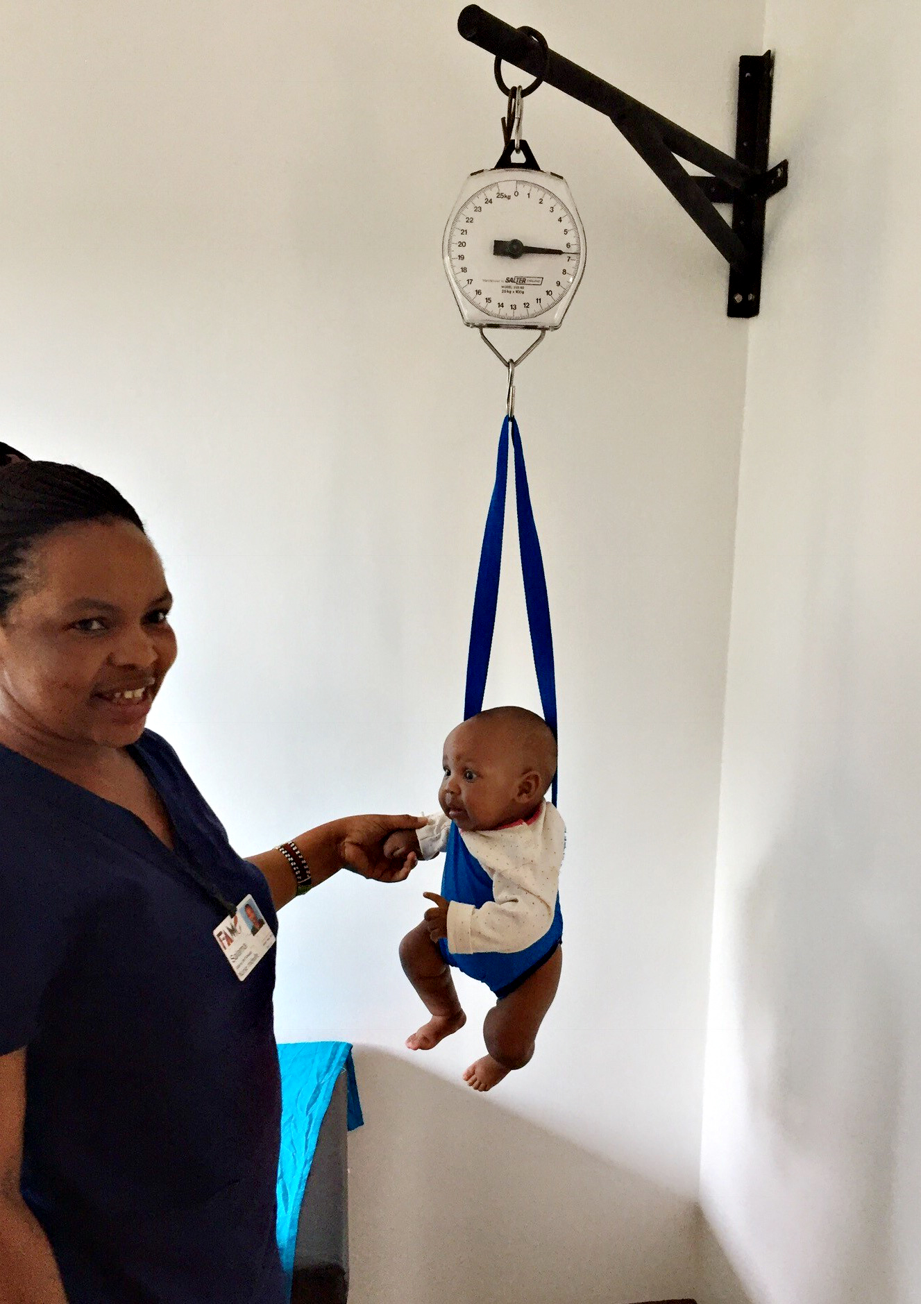 PHOTO: A baby is weighed at FAME medical hospital in Tanzania. 