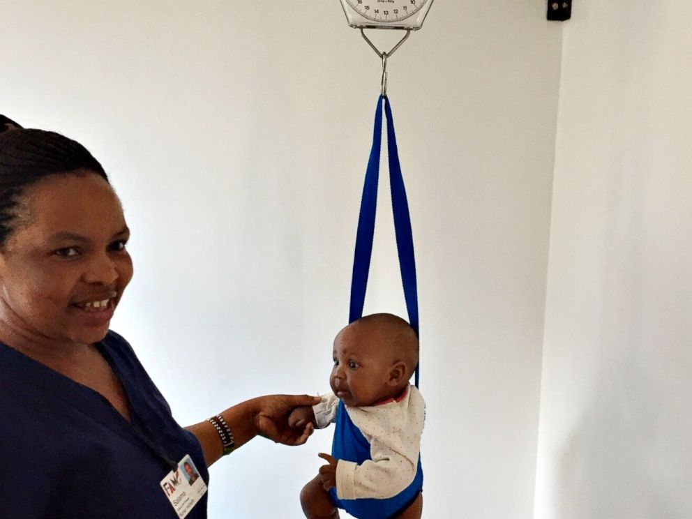 PHOTO: A baby is weighed at FAME medical hospital in Tanzania.