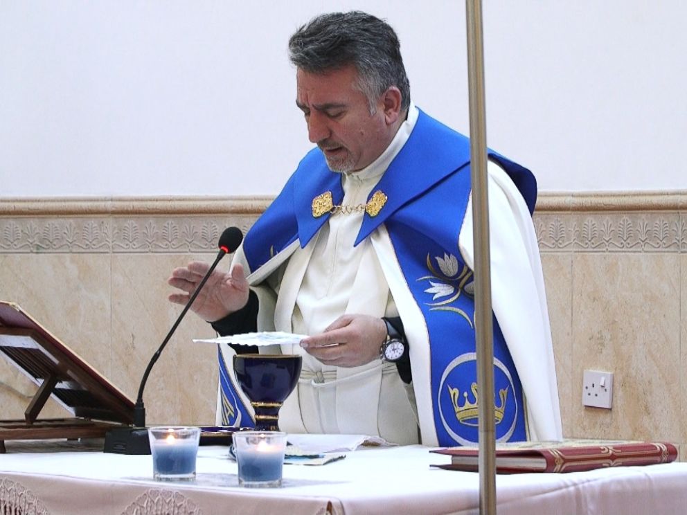Father Douglas Al-Bazi worked with husband-and-wife team Michele and Joseph Assad to find a new home for the refugees in Slovakia.