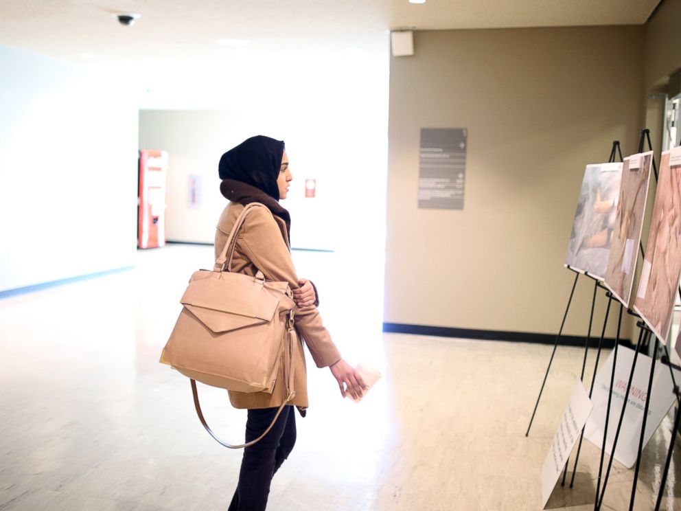 PHOTO: A viewer looks on at the Caesar photo exhibition at the United Nations Headquarters in New York, March 13, 2015.