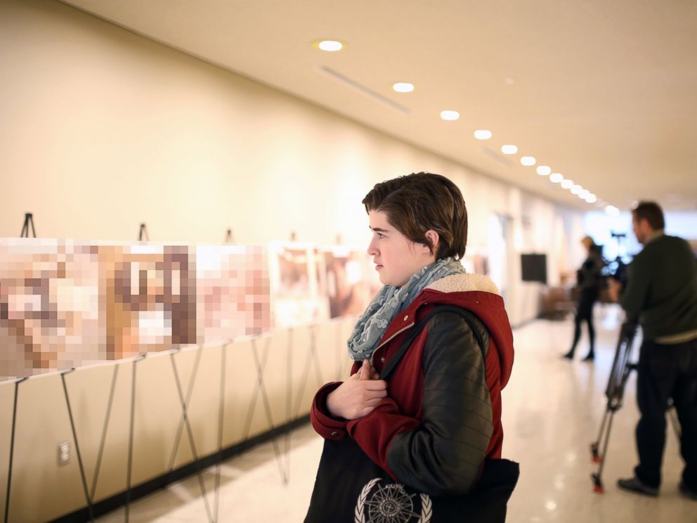 PHOTO: A viewer looks on at the Caesar photo exhibition at the United Nations Headquarters in New York, March 13, 2015.