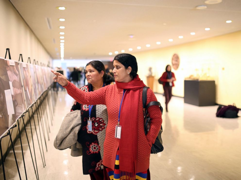 PHOTO: A viewer looks on at the Caesar photo exhibition at the United Nations Headquarters in New York, March 13, 2015.