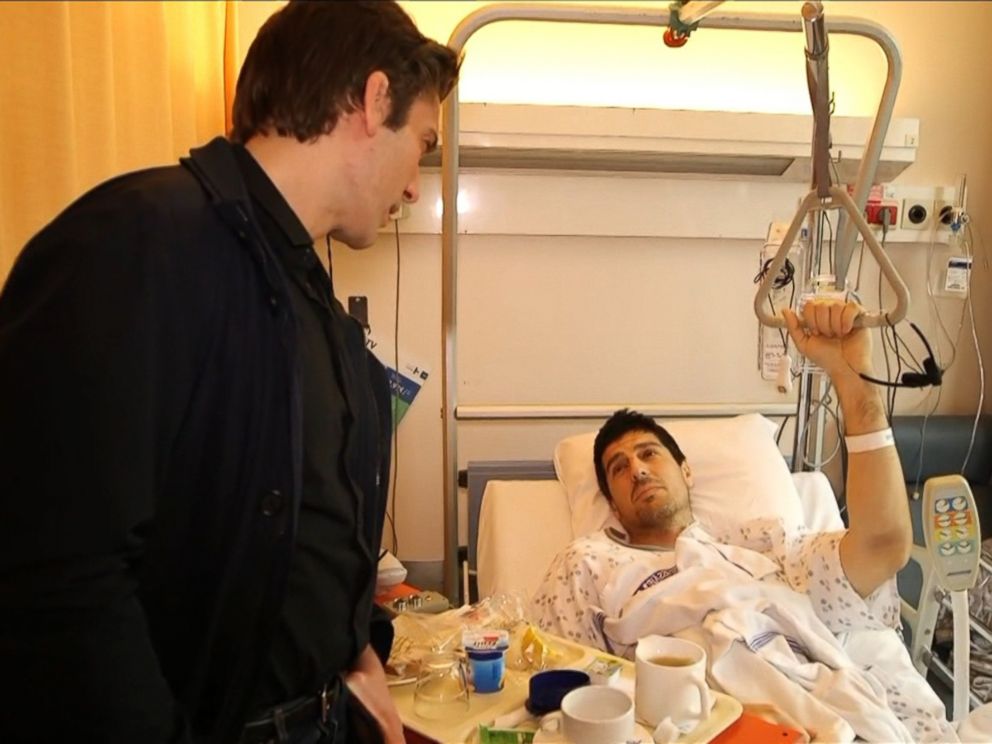 PHOTO: David Muir interviews former basketball player Sebastien Bellin, March 24, 2016.