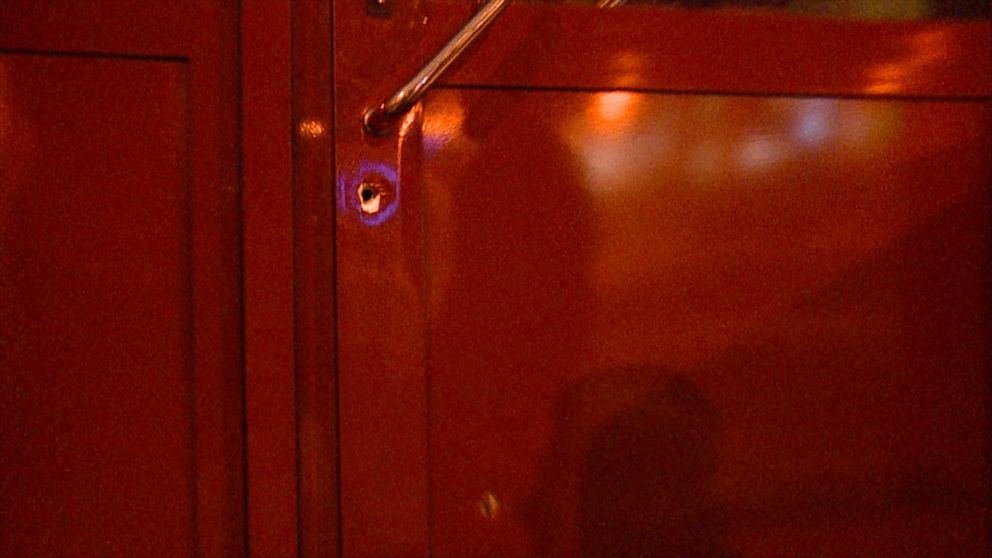 Bullet holes left in the front door of Central Station after an armed attack in November.