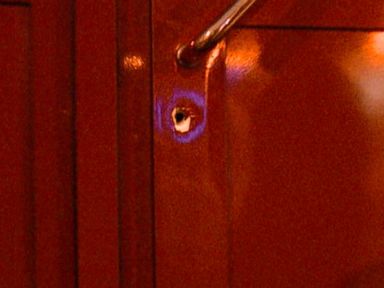 Bullet holes left in the front door of Central Station after an armed attack in November.
