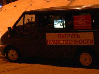 A morality patrol van monitors and videotapes patrons as they enter the club.