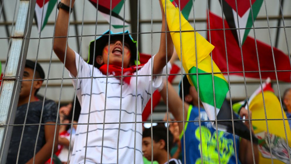 PHOTO: Kids cheering at the Palestine Cup final match. 