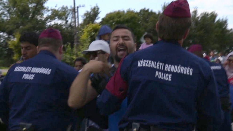 ABC News travels alongside refugees as they flee police in Hungary. 