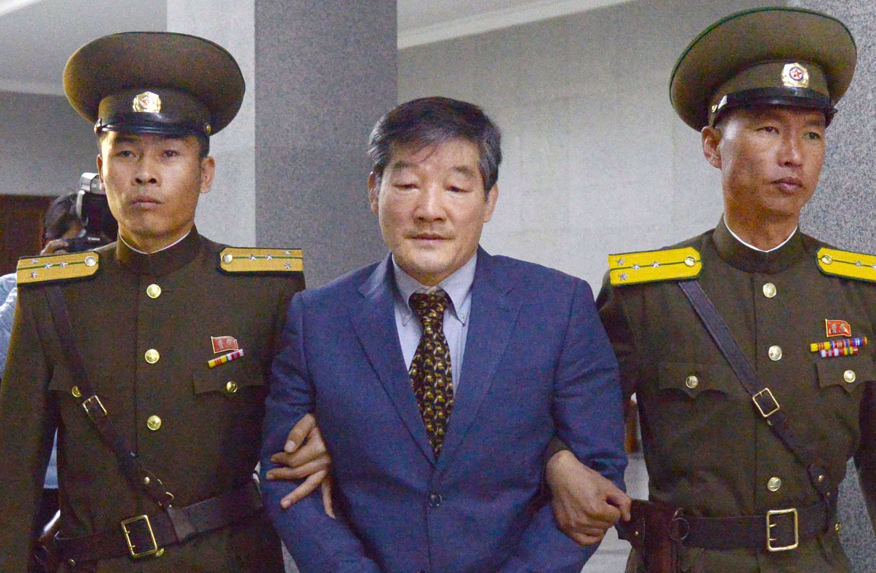 PHOTO: Kim Dong Chul, a Korean-American, is escorted to a courtroom in Pyongyang, North Korea on April 29, 2016. The 62-year-old naturalized U.S. citizen, who has been held since October 2015, was sentenced to 10 years of hard labor.