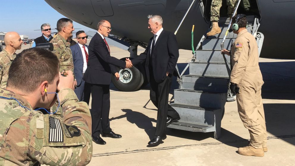 PHOTO: U.S. Sec. of Defense Jim Mattis, center, is greeted by U.S. Ambassador Douglas Silliman as he arrives at Baghdad International Airport on an unannounced trip Monday, Feb. 20, 2017. 