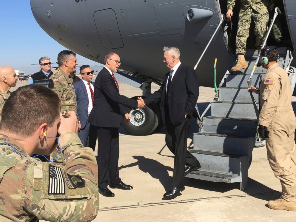PHOTO: U.S. Sec. of Defense Jim Mattis, center, is greeted by U.S. Ambassador Douglas Silliman as he arrives at Baghdad International Airport on an unannounced trip Monday, Feb. 20, 2017.