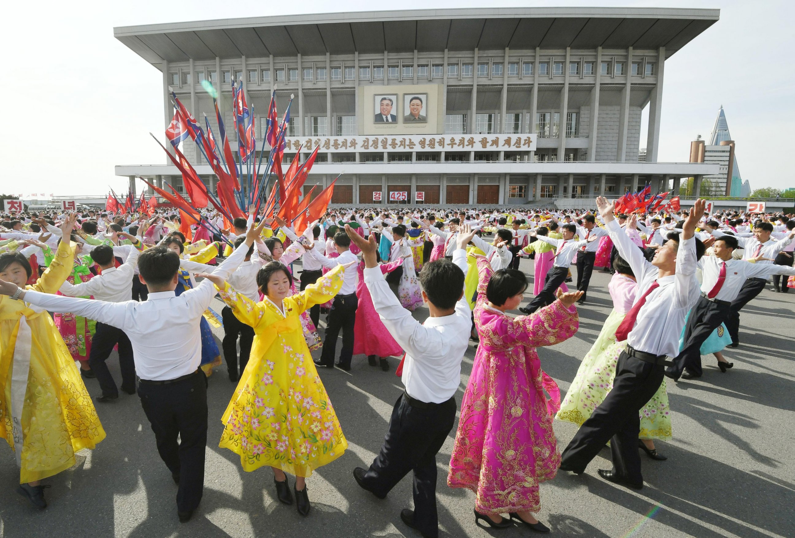 PHOTO: People dance at an outdoor party in North Korea's capital Pyongyang, on April 25, 2017, to mark the 85th anniversary of the founding of the country's armed forces. 