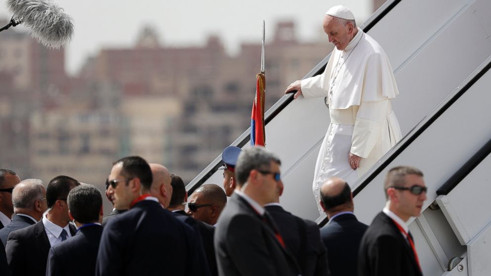 Pope Francis walks down the steps of an airplane upon arriving at Cairo's airport, Egypt, on April 28, 2017. Francis is in Egypt for a two-day trip aimed at presenting a united Christian-Muslim front that repudiates violence committed in God's name. 
