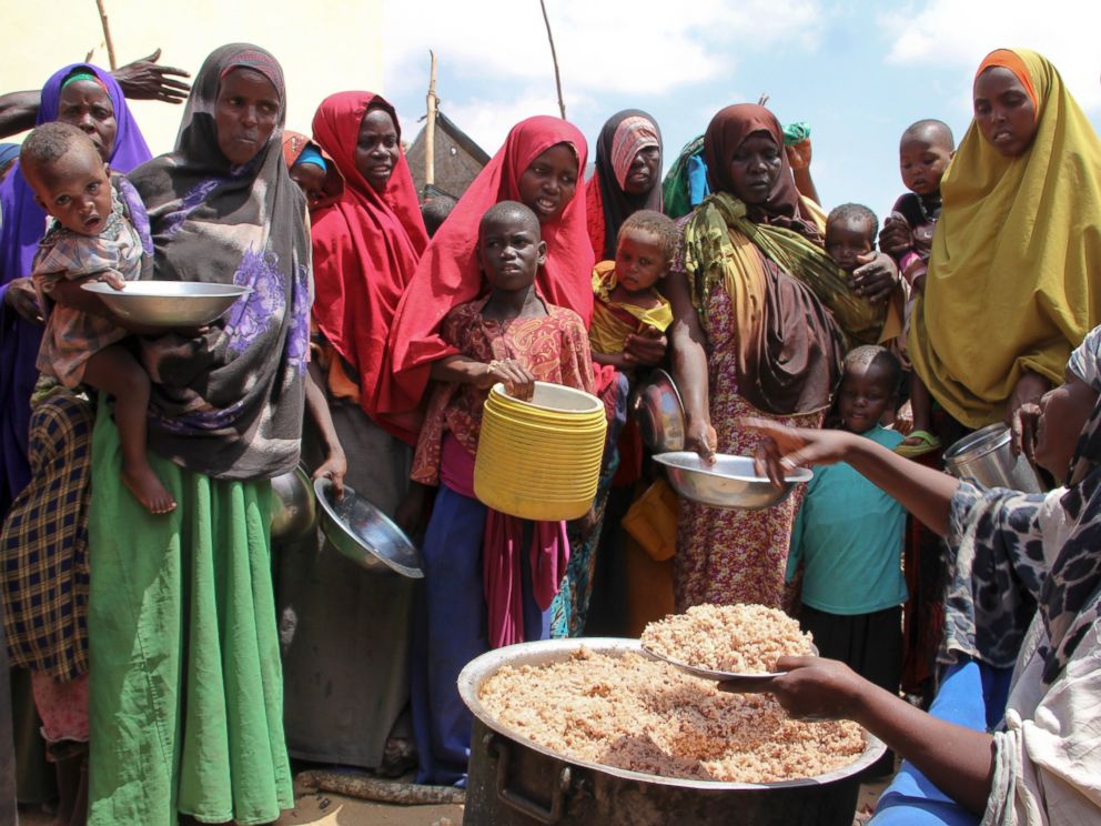 PHOTO: Newly arrived Somalis, displaced by the drought, receive food distributions at makeshift camps in the Tabelaha area on the outskirts of Mogadishu, Somalia, on March 30, 2017.