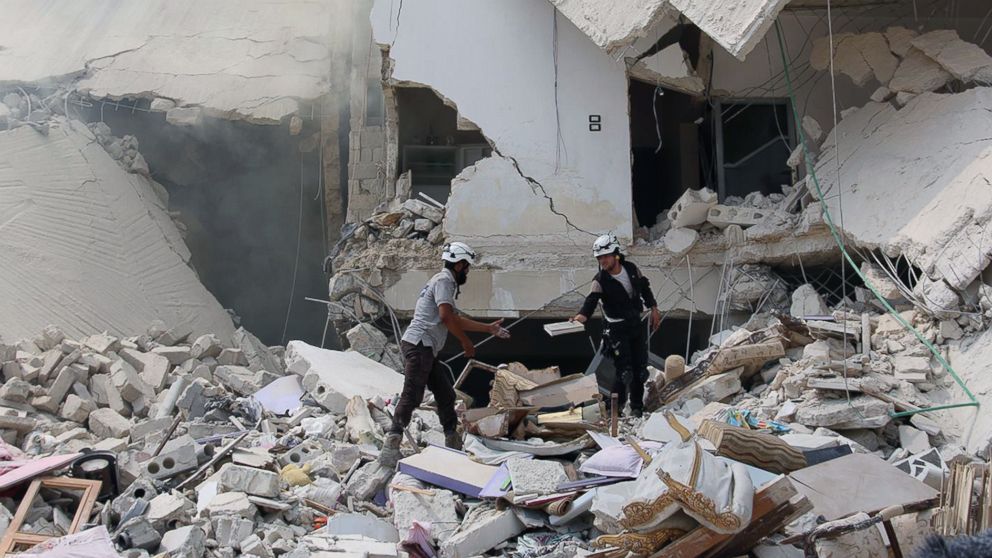 PHOTO: Syrian civil defense workers inspecting damaged buildings, after barrel bombs were dropped on the Bab al-Nairab neighborhood in Aleppo, Syria, Aug. 27, 2016. 