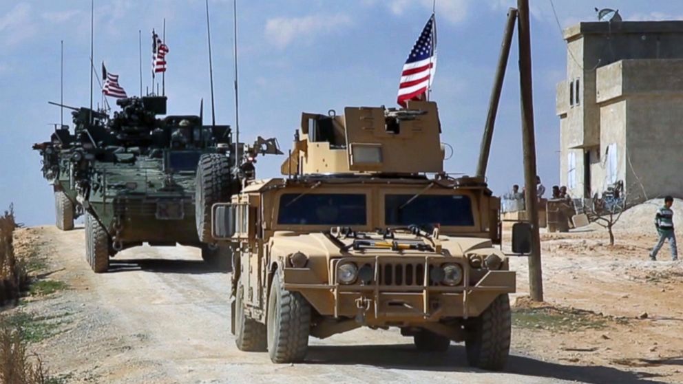This March 7, 2017 grab from video provided by Arab 24 network, shows U.S. forces patroling on the outskirts of the Syrian town, Manbij, a flashpoint between Turkish troops and allied Syrian fighters and U.S.-backed Kurdish fighters, in al-Asaliyah village, Aleppo province, Syria. 