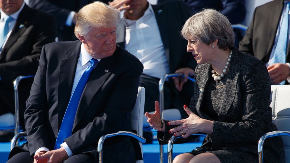 PHOTO: President Donald Trump talks with British Prime Minister Theresa May during a transfer ceremony at the new NATO headquarters, on May 25, 2017, in Brussels.