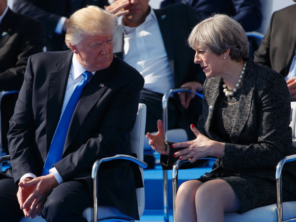 PHOTO: President Donald Trump talks with British Prime Minister Theresa May during a transfer ceremony at the new NATO headquarters, on May 25, 2017, in Brussels.